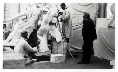 Auguste Rodin in his Paris studio watching the construction of a sculpture, 1905